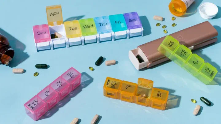 How an AM/PM Box Simplifies Medication Management? Colorful pill organizers for daily medication planning.